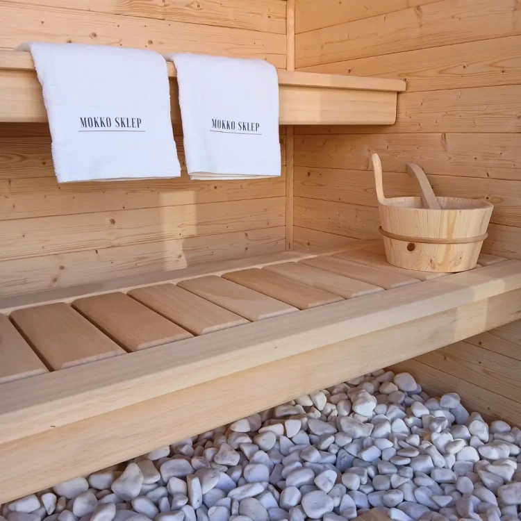 Ekskluzywne wnętrze sauny Mokko: lewitujące ławki z drewna abachi z podświetleniem LED