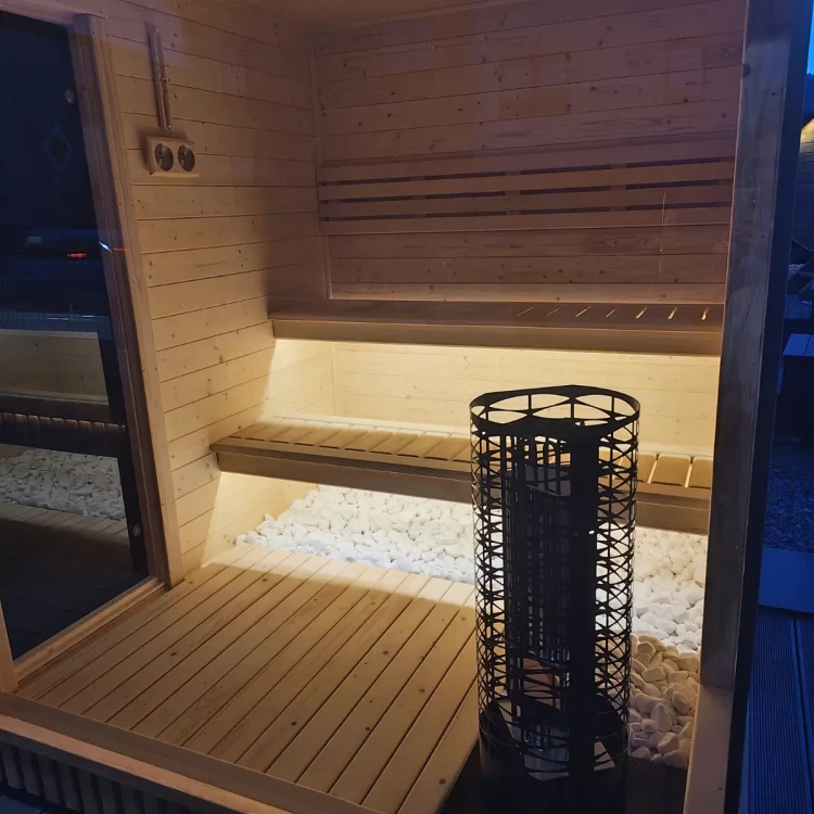 Klimatyczne podświetlenie LED pod lewitującymi ławkami w saunie premium